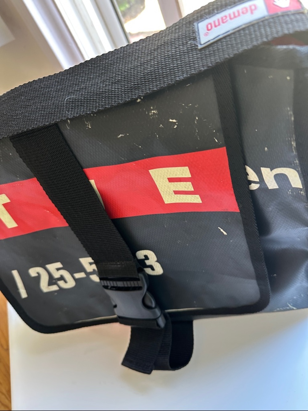 Black and Red Men's Messenger Bag with Secure Buckle